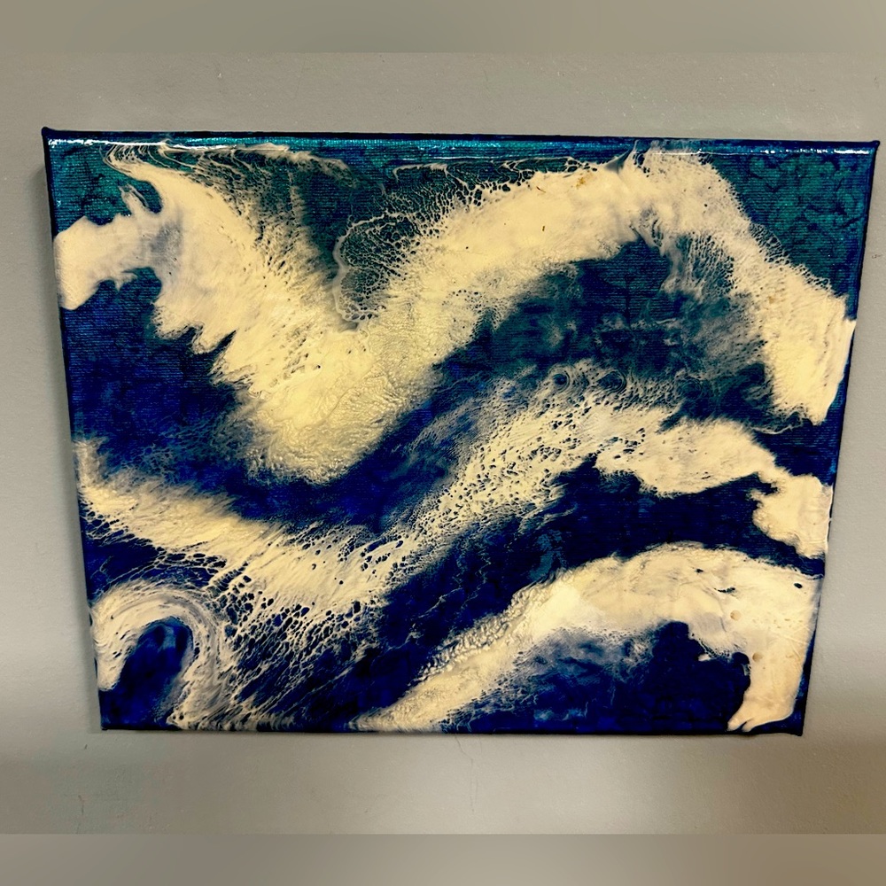 Deep blue ocean waves with sea foam.